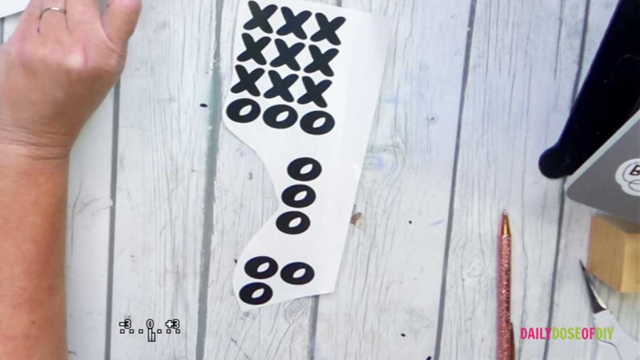 x's and o's cut our of vinyl for wood tic tac toe game