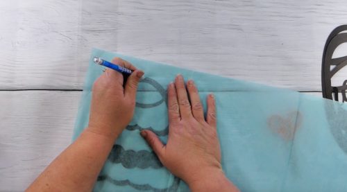 Trace the tissue paper where you need to cut for the Easter egg suncatcher