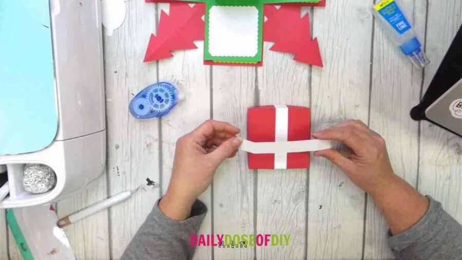 white strips across exploding gift box lid