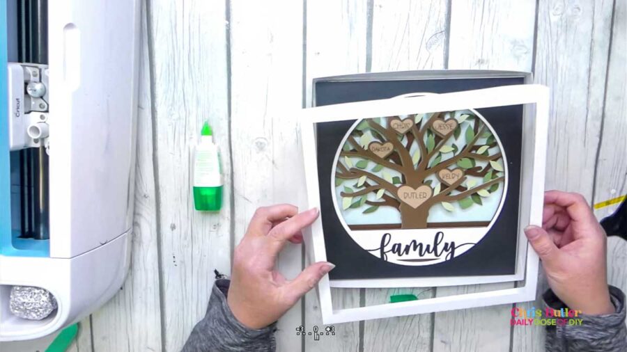 adding the white frame top to the family tree craft 