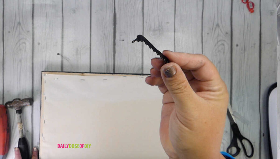 Add a sawtooth hanger to hang your reverse canvas