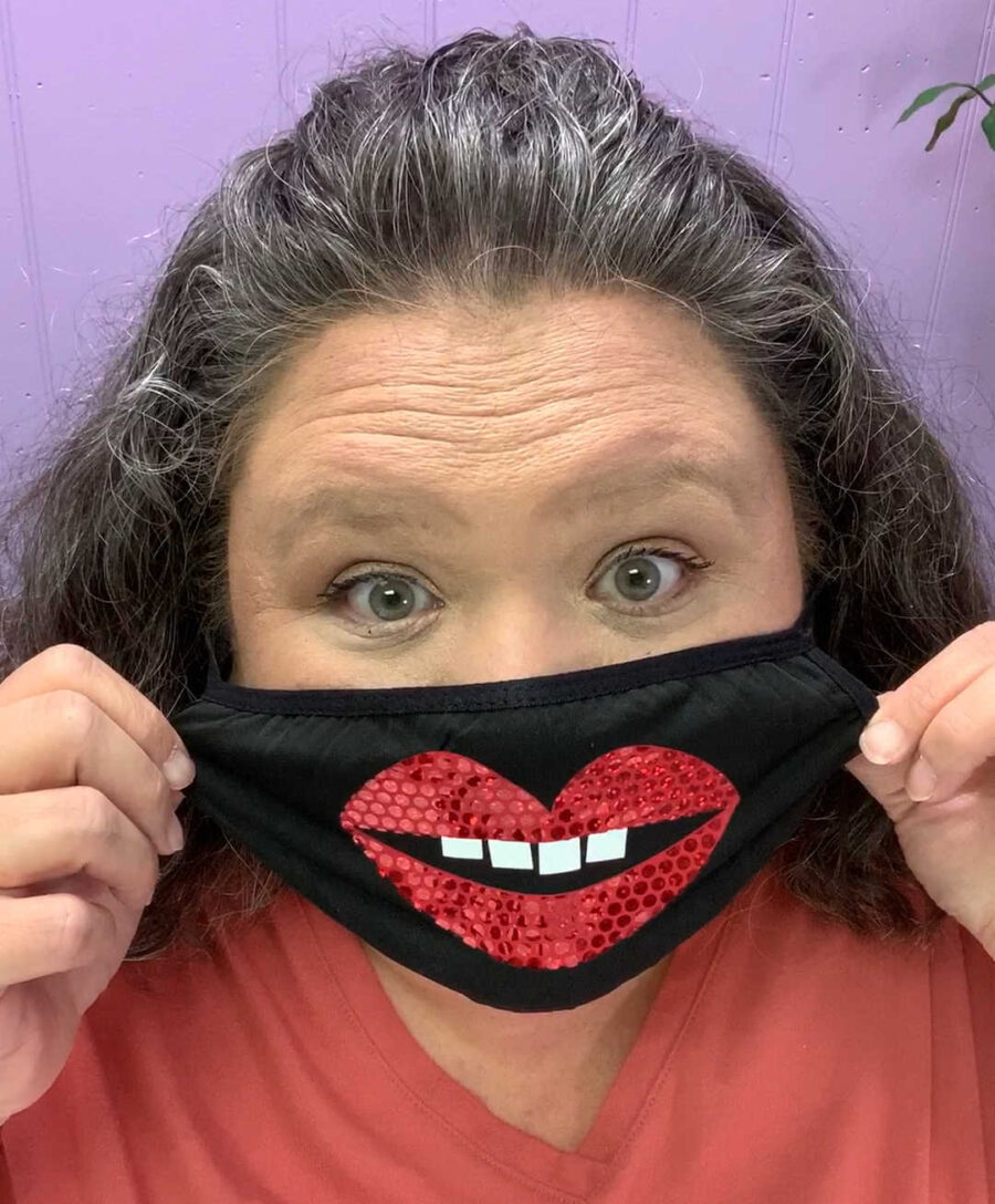 wearing a black face mask with lips SVG made with Cricut 