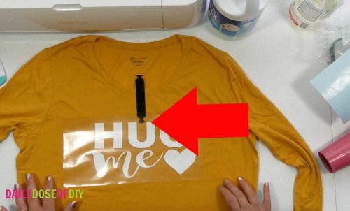 Use a shirt guide to help you center your desing on the bleach spray shirt