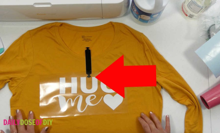 Use a shirt guide to help you center your desing on the bleach spray shirt