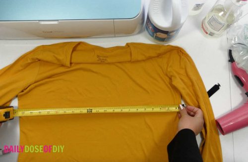 Measuring a shirt to size the design for bleach spray shirts