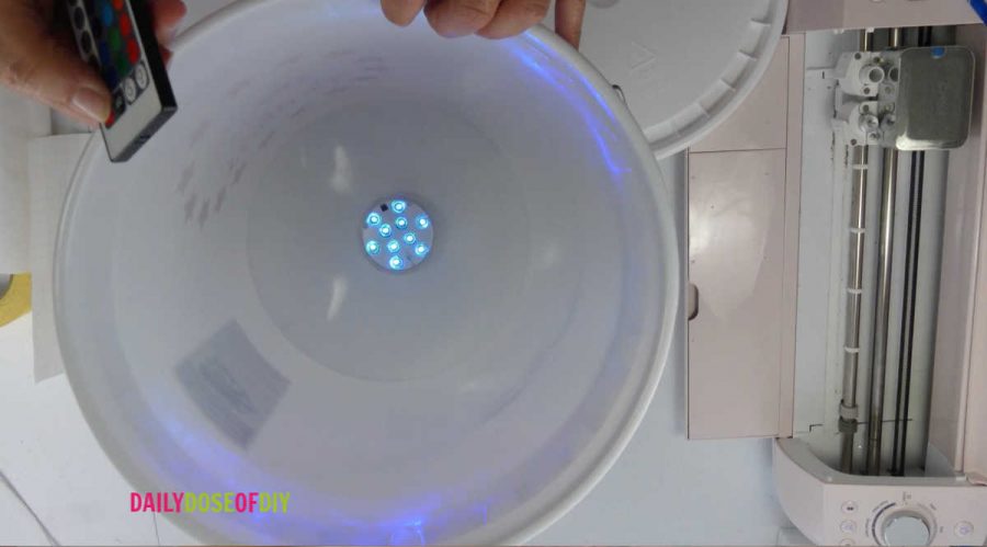 Multi Color LED Puck Light in a camp bucket