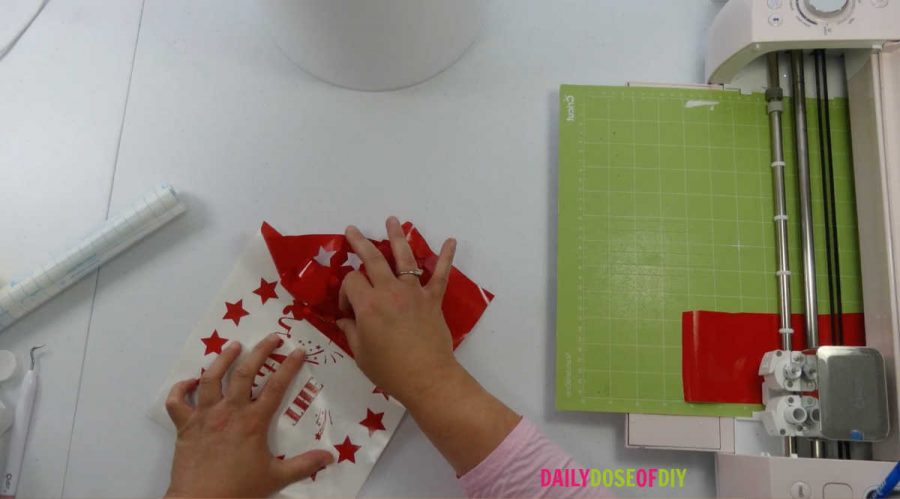 remove the extra vinyl after your desing is cut with a Cricut weeding tool