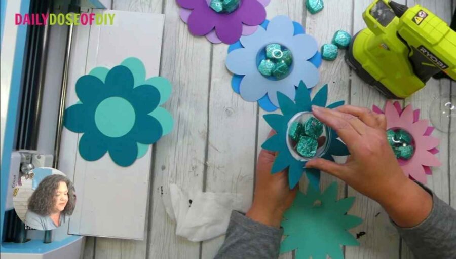add candy to paper flower candy holder
