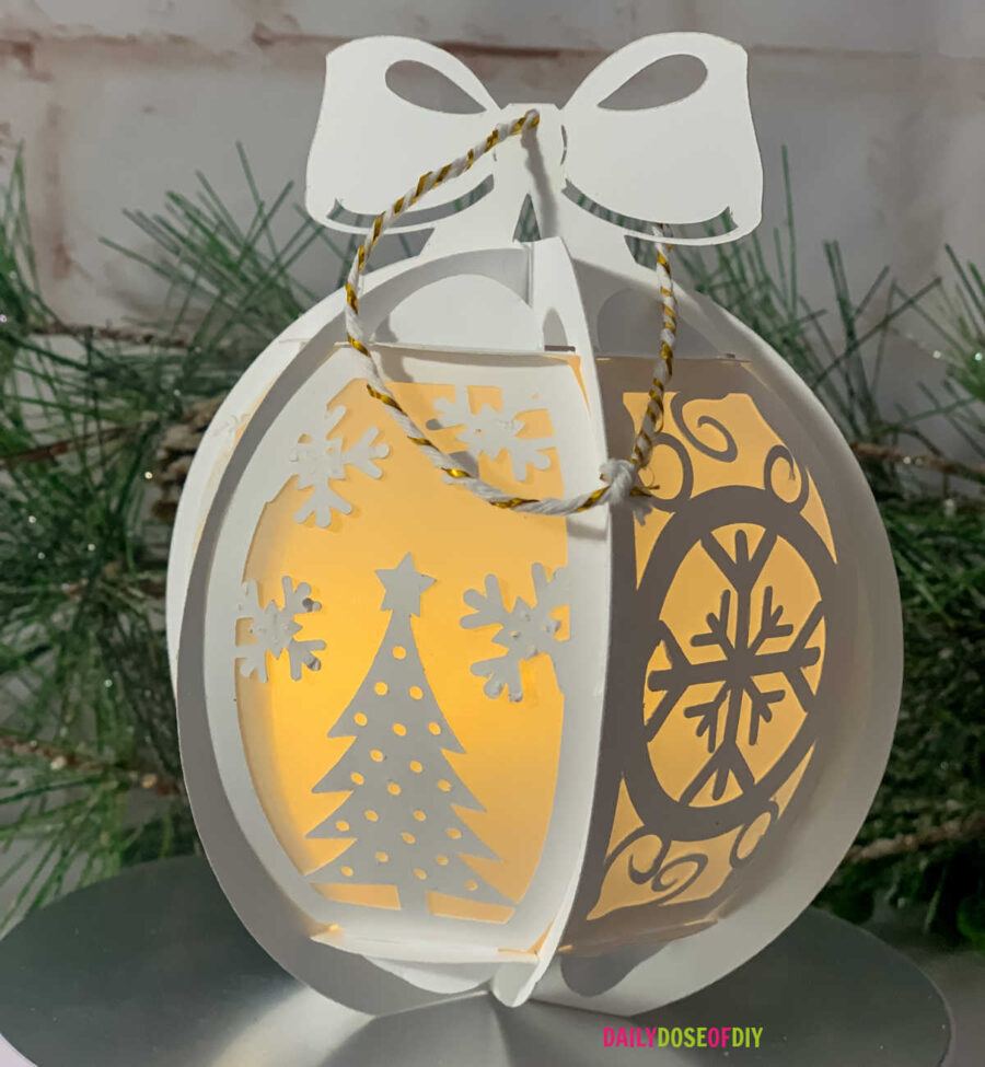 Round Christmas Ornament made out of cardstock and vellum paper with LED lights in the center