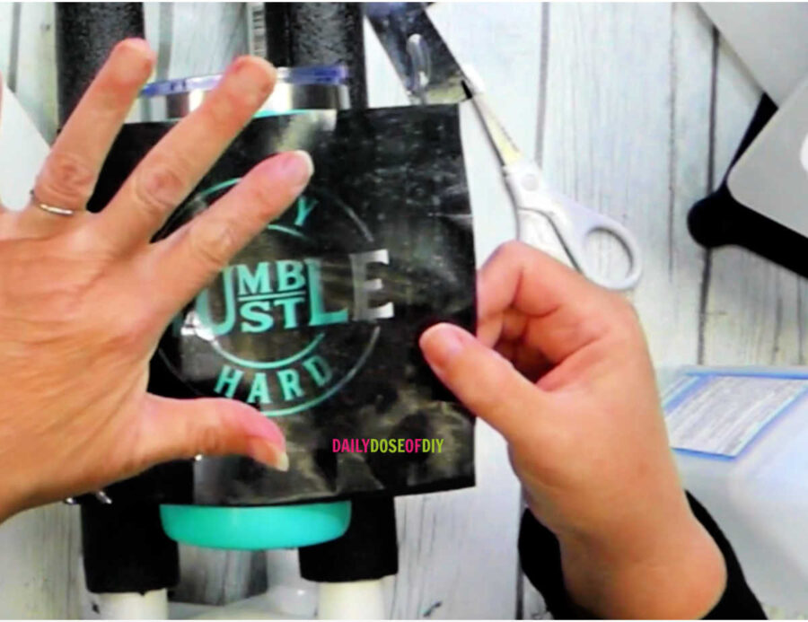 Apply the vinyl stencil to your tumbler in order to citristrip the design. 