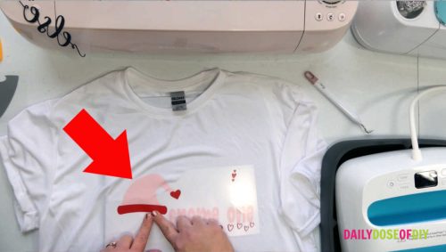 adding layers to iron on vinyl to heat press on a shirt