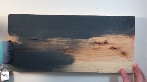 New wood being distressed with paint