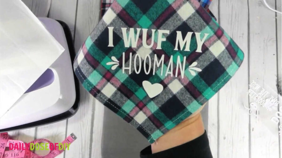 a finished dog bandana that says "I wuf my hooman"