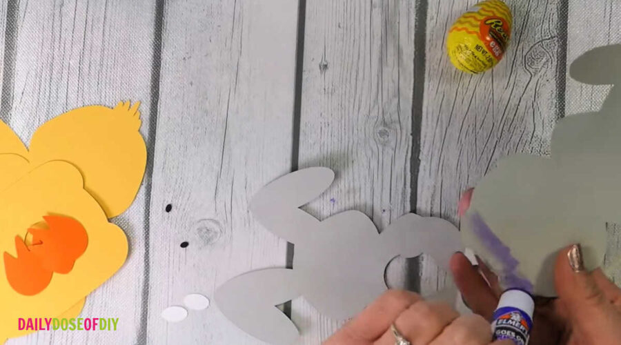 glue the bottom side of the back of the bunny to attach to the cardstock base