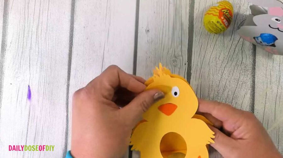 glue the top of the front and back cardstock pieces to hold the design together