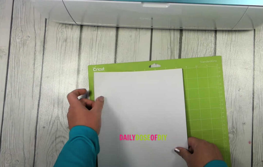 Line the cardstock on the top left corner of you rcut mat to cut on a cricut