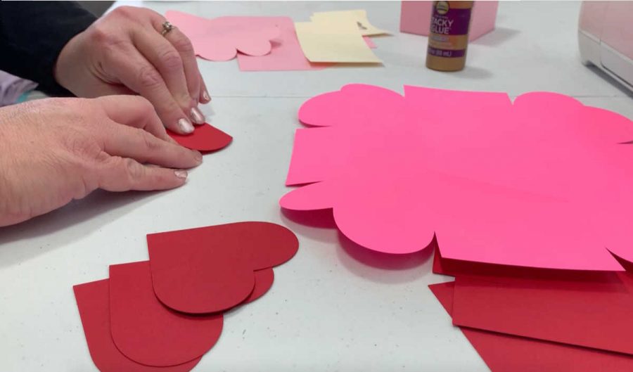 folding red hearts for the exploding box