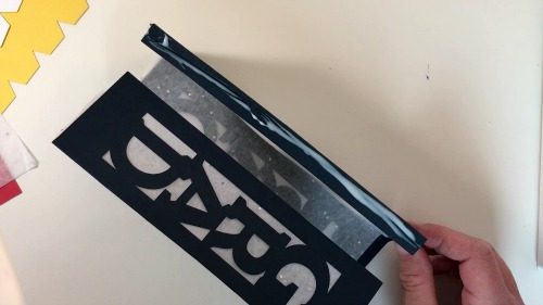 Place glue on the end tab of your lantern to finish your DIY Graduation Decor