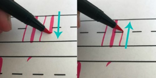 doing downstrokes and upstrokes on hand lettering practice sheets
