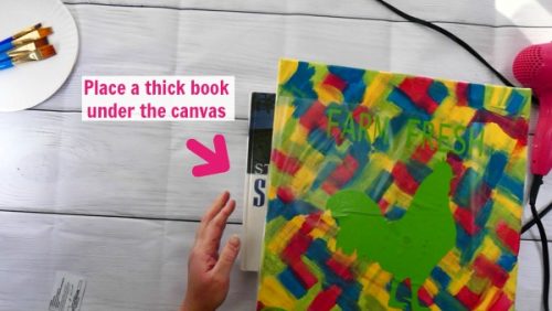 Place a thick book behind the canvas to transfer your design on the hot mess canvas