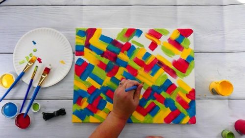 Use contrasting colors of paint to make a hot mess canvas