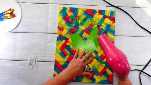 Use a blow dryer ot heat up the vinyl so it sticks well to the hot mess canvas