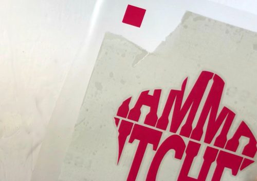 Using guides to layer adhesive vinyl