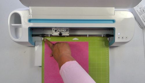 Loading paper into a Cricut cutiing machine