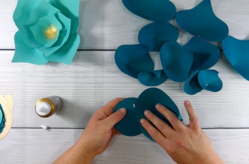 Glue the largest flower petal to the circle base to make a paper flower with your cricut