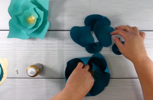 Assembling a paper flower to make a paper flower display