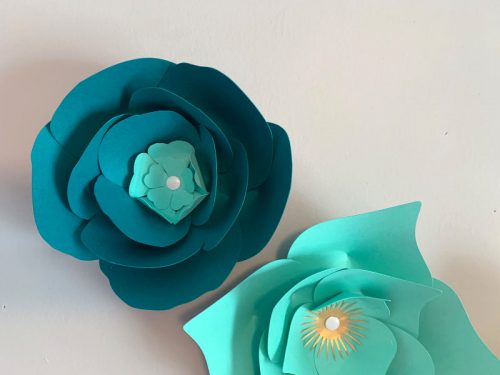 Use thumbtacks in the center of the flower to attach them to a wall to make a paper flower wall display