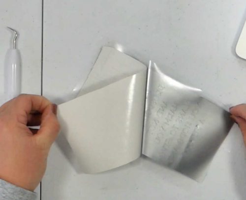 Remove the backing from the vinyl so now your entire vinlyl sheet is stuck to the transfer tape