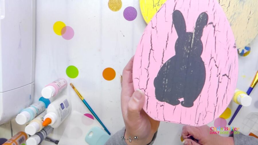 showing a bunny silhouette on a litle pink crackle painted egg 