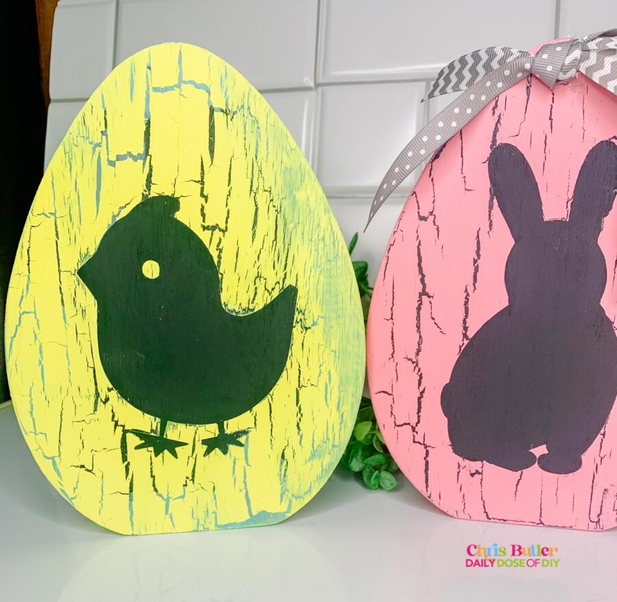 picture of a yellow crackle painted egg with a chick silhoutte in charcoal 