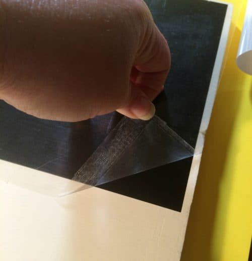 Removing the transfer paper from the Cricut stencil 