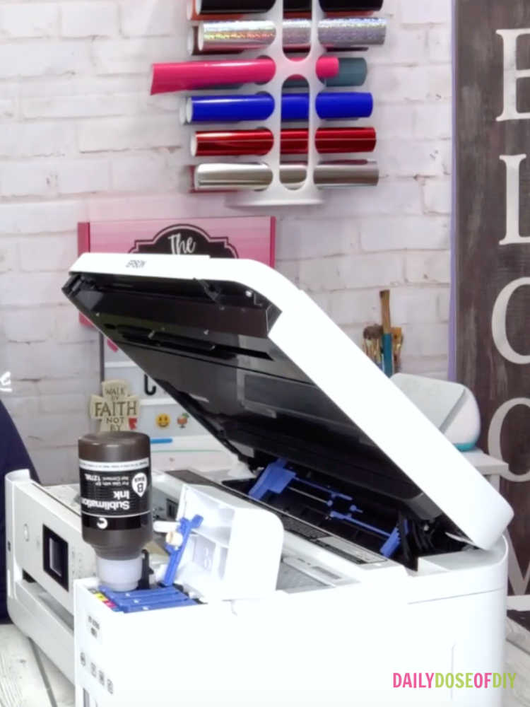 Filling an Epson Ecotank printer with black Hiipoo Sublimation ink. 