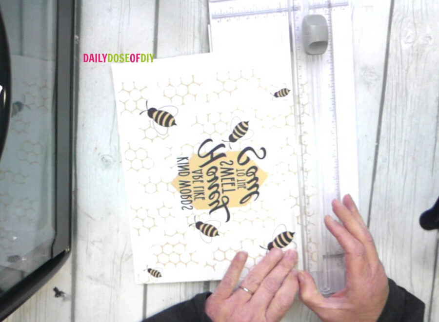 Trimming a printed sublimation design with a paper trimmer