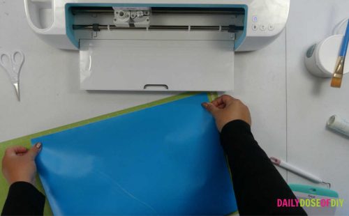 Line the stencil vinyl up on the 24 inch cut mat