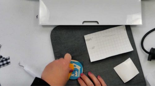 transfer the stencil to the wood slice ornament