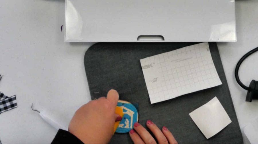 transfer the stencil to the wood slice ornament
